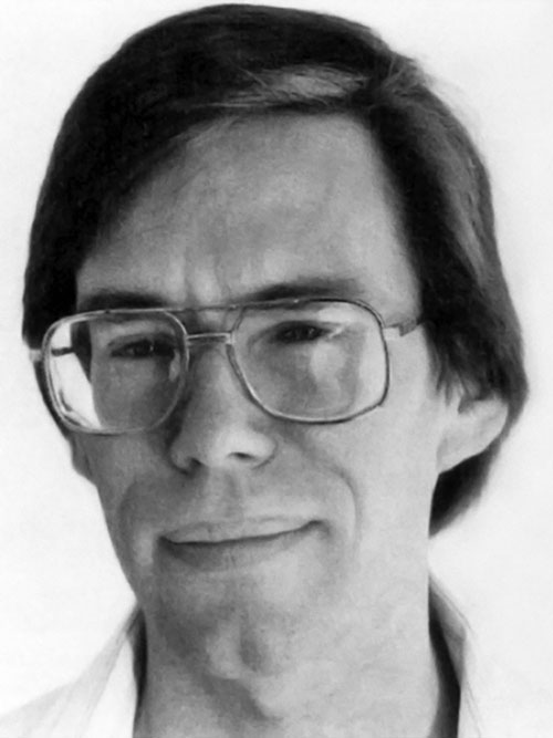Black-and-white portrait of Bob Lazar wearing glasses.