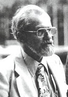 Historical black-and-white portrait of J. Allen Hynek in glasses and a suit.