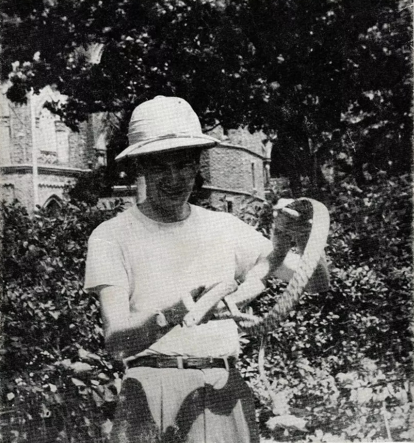 John Keel wearing a field hat and holding a snake in a photograph from the Jadoo dust jacket.