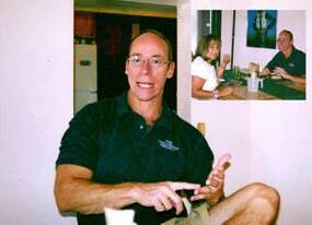 Steven Greer seated and wearing a green shirt.